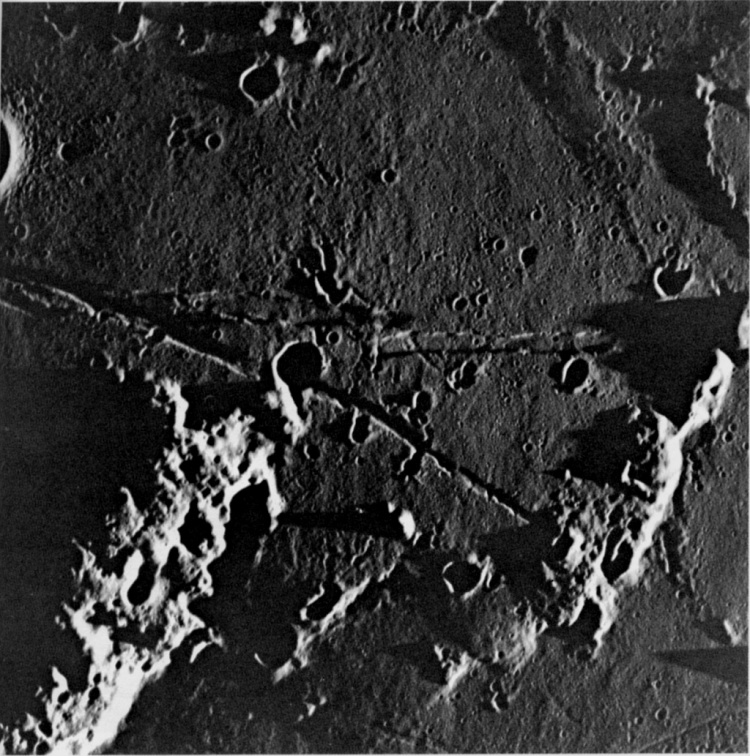 Lunar surface, oblique view across Moltke and Rima Hypatia. 24.2° E, 0.6° N. 80mm. Apollo 10, 1969