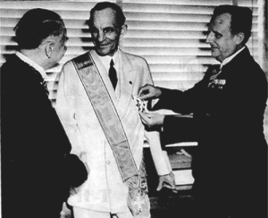 German diplomats award Henry Ford, centre, their nation’s highest decoration for foreigners, the Grand Cross of the German Eagle, July 1938
